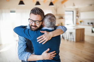 Man embracing someone and learning how to prepare for rehab